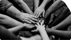 A group of people holding hands in black and white.