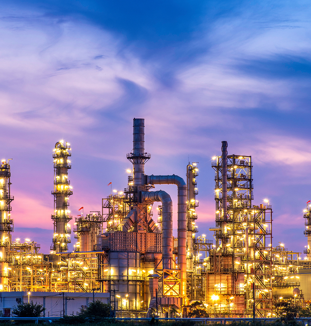 Oil refinery at night with lights.