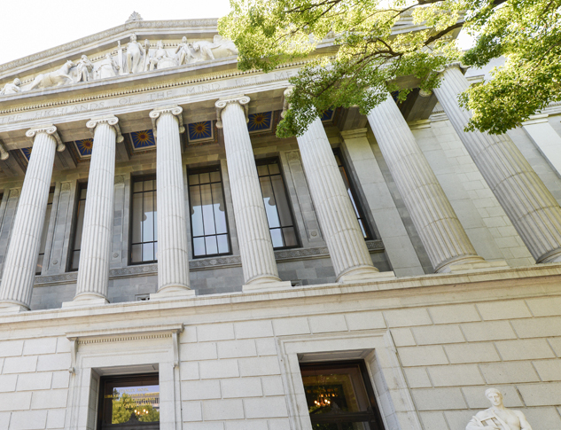 Exterior view of courts building with columns.