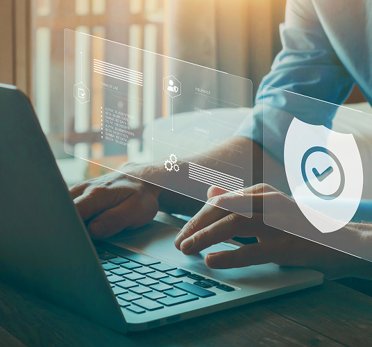 Man typing on laptop with visual of insurance check overlaid on image