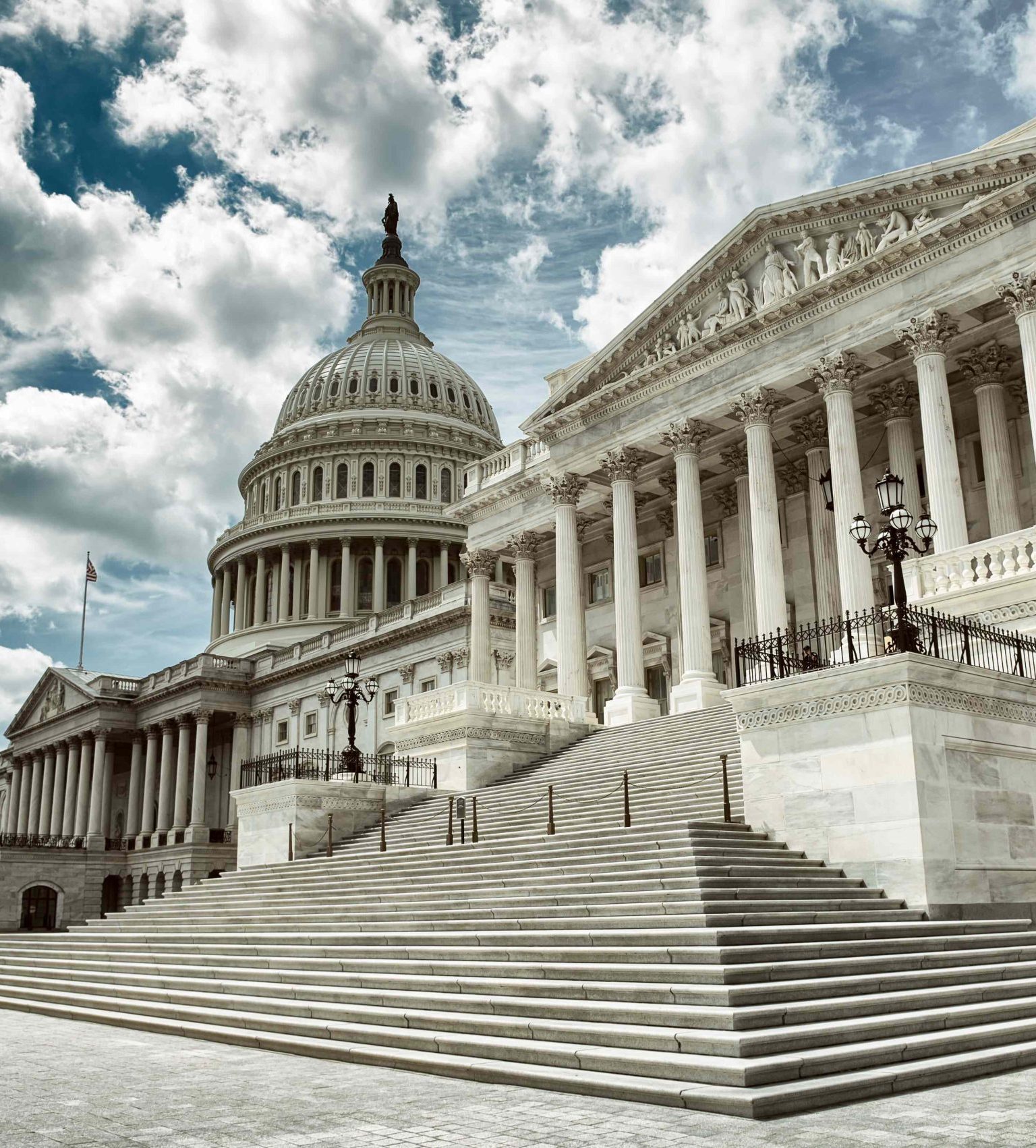Cloudy weather over exterior view of the US Capitol Building