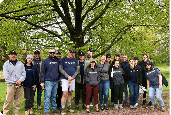 A group of employees posing for a picture